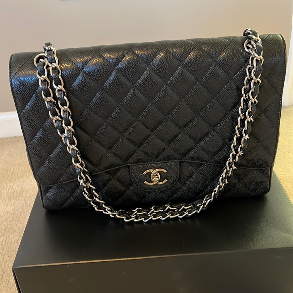 Chanel black classic single flap caviar maxi with silver hardware handbag